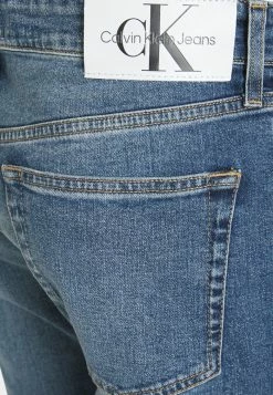 Calvin Klein Jeans SLIM TAPER - Jeans Fuselé - Denim Light -Calvin Klein Elegant Magasin 02f1f645833f4a19aeb29f089c3920df
