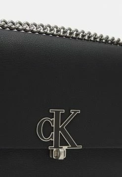 Calvin Klein Jeans MINIMAL MONOGRAM FLAP - Sac Bandoulière - Black -Calvin Klein Elegant Magasin 0bef0ada023846e68a6dd7eea728fe19