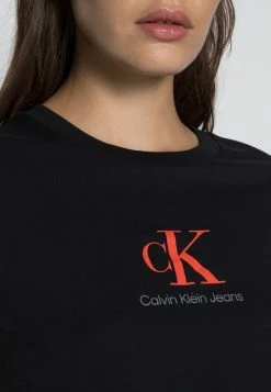 Calvin Klein Jeans BABY TEE - T-shirt Imprimé - Black -Calvin Klein Elegant Magasin 1202ea99768c40a89ca1b141335f1665