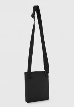 Calvin Klein Jeans FLATPACK UNISEX - Sac Bandoulière - Black -Calvin Klein Elegant Magasin 281af988a3954f23b6e18329aaa74969