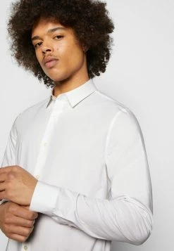 Calvin Klein Jeans CHEST LOGO SLIM STRETCH SHIRT - Chemise - Bright White -Calvin Klein Elegant Magasin 315bbfe6e8b241b5841395b6b65afddc