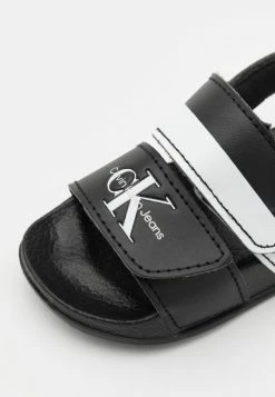Calvin Klein Jeans UNISEX - Sandales - Black/white -Calvin Klein Elegant Magasin 3185af97beda4870a4d270b121d55ddc