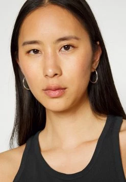 Calvin Klein Jeans STACKED LOGO RACER BACK - Débardeur - Black -Calvin Klein Elegant Magasin 31fb952c76764f4d97425bd57f9269e2