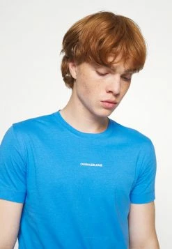 Calvin Klein Jeans MICRO BRANDING ESSENTIAL TEE - T-shirt Basique - Blue -Calvin Klein Elegant Magasin 33b98b991d9049558d3372ca33530791