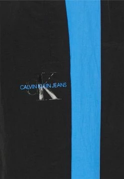 Calvin Klein Jeans COLOR BLOCK TRACK PANT - Pantalon De Survêtement - Black -Calvin Klein Elegant Magasin 34bc119178e14bc091af593aea628148