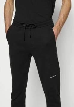 Calvin Klein Jeans MICRO BRANDING PANT - Pantalon De Survêtement - Black -Calvin Klein Elegant Magasin 358c1cae6cf145a5a5eb7f8830694e8f