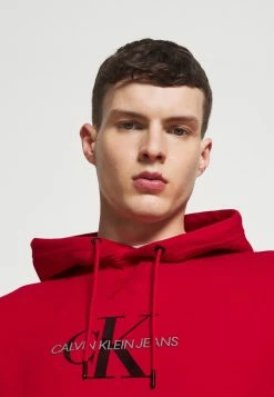 Calvin Klein Jeans ARCHIVAL MONOGRAM HOODIE UNISEX - Sweatshirt - Salsa/black -Calvin Klein Elegant Magasin 370b8fc5ca36425c9c01f1643b63a932