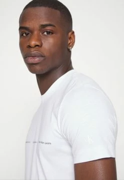 Calvin Klein Jeans REPEAT LOGO TEE UNISEX - T-shirt Imprimé - Bright White -Calvin Klein Elegant Magasin 37b607dca12347d487dde25288a7f101