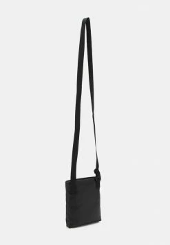 Calvin Klein Jeans MONOGRAM SOFT FLATPACK S - Sac Bandoulière - Black -Calvin Klein Elegant Magasin 394e80f2364c49d8b1e22074acba790a