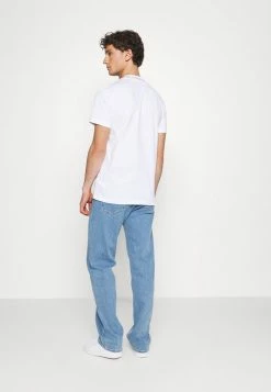 Calvin Klein Jeans LOGO TEE UNISEX - T-shirt Imprimé - White -Calvin Klein Elegant Magasin 3e9d7647cd5a4320abbbb69bb2b52dd1