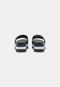 Calvin Klein Jeans FLATFORM SLIDE - Mules à Talons - Black -Calvin Klein Elegant Magasin 3fff26d8a1b84ec5a8a9406f71d23d97