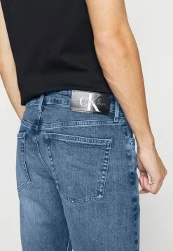 Calvin Klein Jeans SLIM TAPER - Jeans Fuselé - Denim Medium -Calvin Klein Elegant Magasin 43c6e51b3f204ccda269b1662dba9250