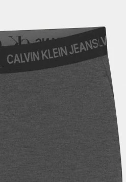 Calvin Klein Jeans PUNTO LOGO TAPE FLARE PANTS - Legging - Dark Grey Heather -Calvin Klein Elegant Magasin 49d86fb564ee494f93b5f7fa795fe1d6