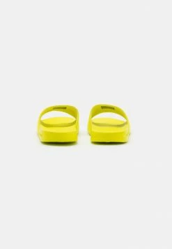 Calvin Klein Jeans SLIDE MONOGRAM - Mules - Lemon Lime -Calvin Klein Elegant Magasin 4b5a1b13681441918081918506c3e7e9