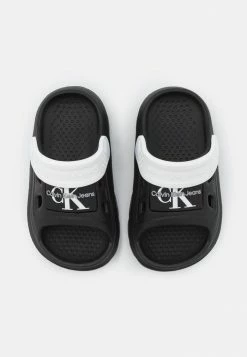 Calvin Klein Jeans UNISEX - Mules - Black/white 9 Calvin Klein Jeans UNISEX - Mules - Black/white -Calvin Klein Elegant Magasin 4edb7533c2d8423896984f84cca474b4
