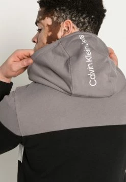 Calvin Klein Jeans COLORBLOCK QUARTER ZIP HOODIE - Sweatshirt - Black -Calvin Klein Elegant Magasin 50fe277ac08947f390eecbde546a5235
