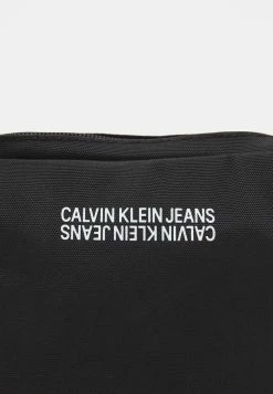 Calvin Klein Jeans SPORT ESSENTIALREPORTER UNISEX - Sac Bandoulière - Black -Calvin Klein Elegant Magasin 59308f2b862d44fa9a7825e187654d01