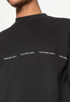 Calvin Klein Jeans REPEAT LOGO CREW NECK UNISEX - Sweatshirt - Black -Calvin Klein Elegant Magasin 59a805658c2a4b8691256b6c2b91c2c1