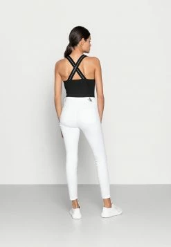 Calvin Klein Jeans HIGH RISE SUPER SKINNY ANKLE - Jeans Skinny - White -Calvin Klein Elegant Magasin 68436a2b0a054603b5c2c0938672924d