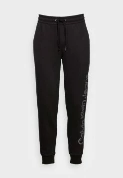 Calvin Klein Jeans VERTICAL BOLD INSTIT PANT - Pantalon De Survêtement - Black -Calvin Klein Elegant Magasin 6976cef2b4f24c258cf6f93e92247b8b