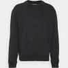 Calvin Klein Jeans CREW NECK UNISEX - Sweatshirt - Washed Black