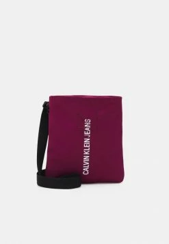 Calvin Klein Jeans MICRO FLATPACK OUTLINE UNISEX - Sac Bandoulière - Purple