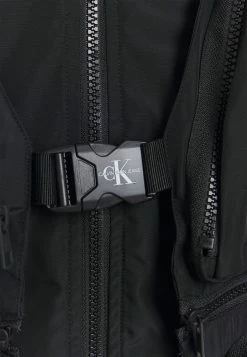 Calvin Klein Jeans TECHNICAL 2 IN 1 UTILITY JACKET - Veste Sans Manches - Black -Calvin Klein Elegant Magasin 704b8bfc48cf4084b593d32cfb0d388b