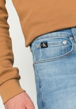 Calvin Klein Jeans SLIM TAPER - Jeans Fuselé - Denim Medium -Calvin Klein Elegant Magasin 734b44de1f49435ea9c6d28e9f94f323