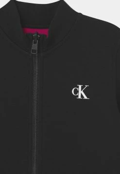 Calvin Klein Jeans REVERSIBLE ZIP THROUGH - Gilet - Black -Calvin Klein Elegant Magasin 73b52d964b414944b79bcbd0c160a405