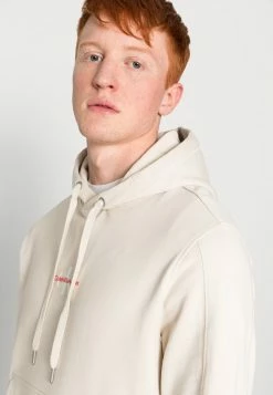 Calvin Klein Jeans MONOGRAM LOGO - Sweat à Capuche - Eggshell -Calvin Klein Elegant Magasin 7ef4f599cca7421080b7a2ecaf69e220