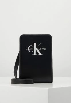 Calvin Klein Jeans MONOGRAM POUCH - Sac Bandoulière - Black