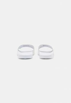 Calvin Klein Jeans SLIDE MONOGRAM - Mules - Bright White -Calvin Klein Elegant Magasin 859de5f60d5548c69bcb721555ae9ab6