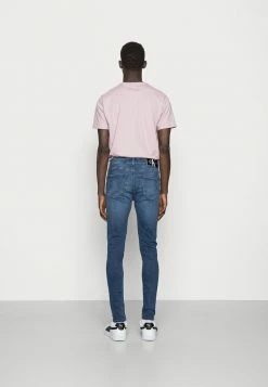 Calvin Klein Jeans SUPER SKINNY - Jean Slim - Denim Dark -Calvin Klein Elegant Magasin 885e978666cb4ad6bb74ca81e80476da