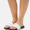 Calvin Klein Jeans INSTITUTIONAL SLIDE - Mules - Bright White