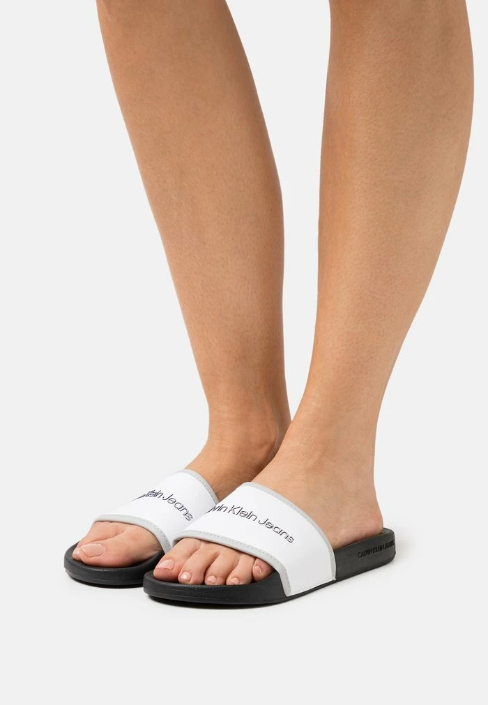 Calvin Klein Jeans INSTITUTIONAL SLIDE - Mules - Bright White 1 Calvin Klein Jeans INSTITUTIONAL SLIDE - Mules - Bright White
