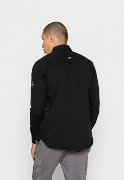 Calvin Klein Jeans MONOGRAM BADGE - Chemise - Black -Calvin Klein Elegant Magasin 9778c94a63ea4d55997122146cc968b6