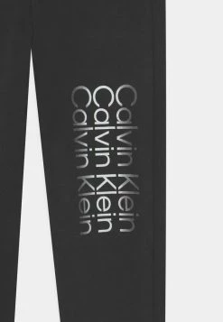 Calvin Klein Jeans CUT OFF LOGO UNISEX - Pantalon De Survêtement - Black -Calvin Klein Elegant Magasin 9a97182e28d54c539c73f59fc28b7523