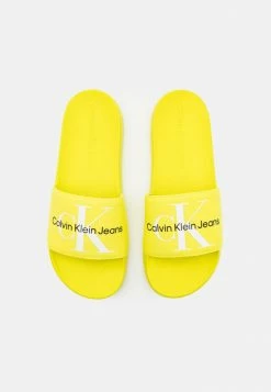 Calvin Klein Jeans SLIDE MONOGRAM - Mules - Lemon Lime -Calvin Klein Elegant Magasin 9d7f160b52164293a9e1ef5e8fcbc3f3