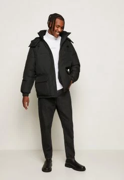 Calvin Klein Jeans BLOCKING HOODED PUFFER - Veste D'hiver - Black -Calvin Klein Elegant Magasin 9f60e568e5f0459a91b29e5801f71bba