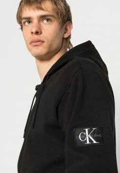 Calvin Klein Jeans MONOGRAM BADGE - Sweat à Capuche Zippé - Black -Calvin Klein Elegant Magasin a143cf2636084b6aa67ece2b8f5fae2d