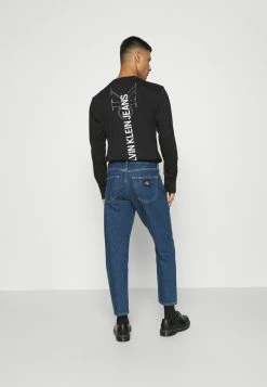 Calvin Klein Jeans SLIM TAPER - Jeans Fuselé - Denim Medium -Calvin Klein Elegant Magasin a6bbb5b535084e19aba5be4d1676afe6