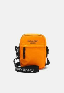 Calvin Klein Jeans LOGO TAPE CROSSBODY UNISEX - Sac Bandoulière - Orange Summit