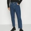 Calvin Klein Jeans SLIM TAPER - Jeans Fuselé - Denim Medium