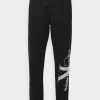 Calvin Klein Jeans TWO TONE MONOGRAM PANT - Pantalon De Survêtement - Black