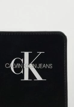Calvin Klein Jeans MONOGRAM POUCH - Sac Bandoulière - Black -Calvin Klein Elegant Magasin bb9666055115472aa226550517012891