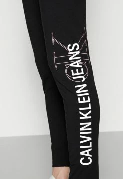 Calvin Klein Jeans VERTICAL INSTITUTIONAL - Legging - Black -Calvin Klein Elegant Magasin c0b9f90deb5949a485c19bb7d0aebcf5