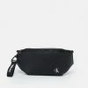 Calvin Klein Jeans TAGGED WAISTBAG UNISEX - Sac Banane - Black