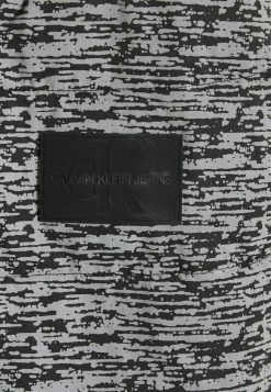 Calvin Klein Jeans REFLECTIVE PUFFER UNISEX - Veste D'hiver - White Noise -Calvin Klein Elegant Magasin c70aa590a6ff4c0293ab8f424697efe3