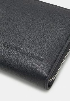 Calvin Klein Jeans ULTRALIGHT ZIP AROUND - Portefeuille - Black -Calvin Klein Elegant Magasin c9975d4e74c4407c92db160f84004402