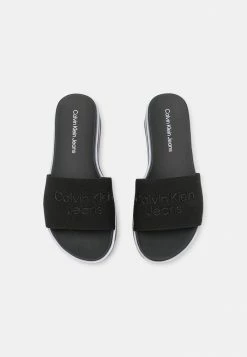 Calvin Klein Jeans FLATFORM SLIDE - Mules à Talons - Black -Calvin Klein Elegant Magasin d6108f6af589479d94e43fbff9293ee9